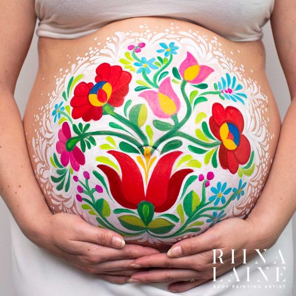 Floral pregnancy belly painting by Riina Laine